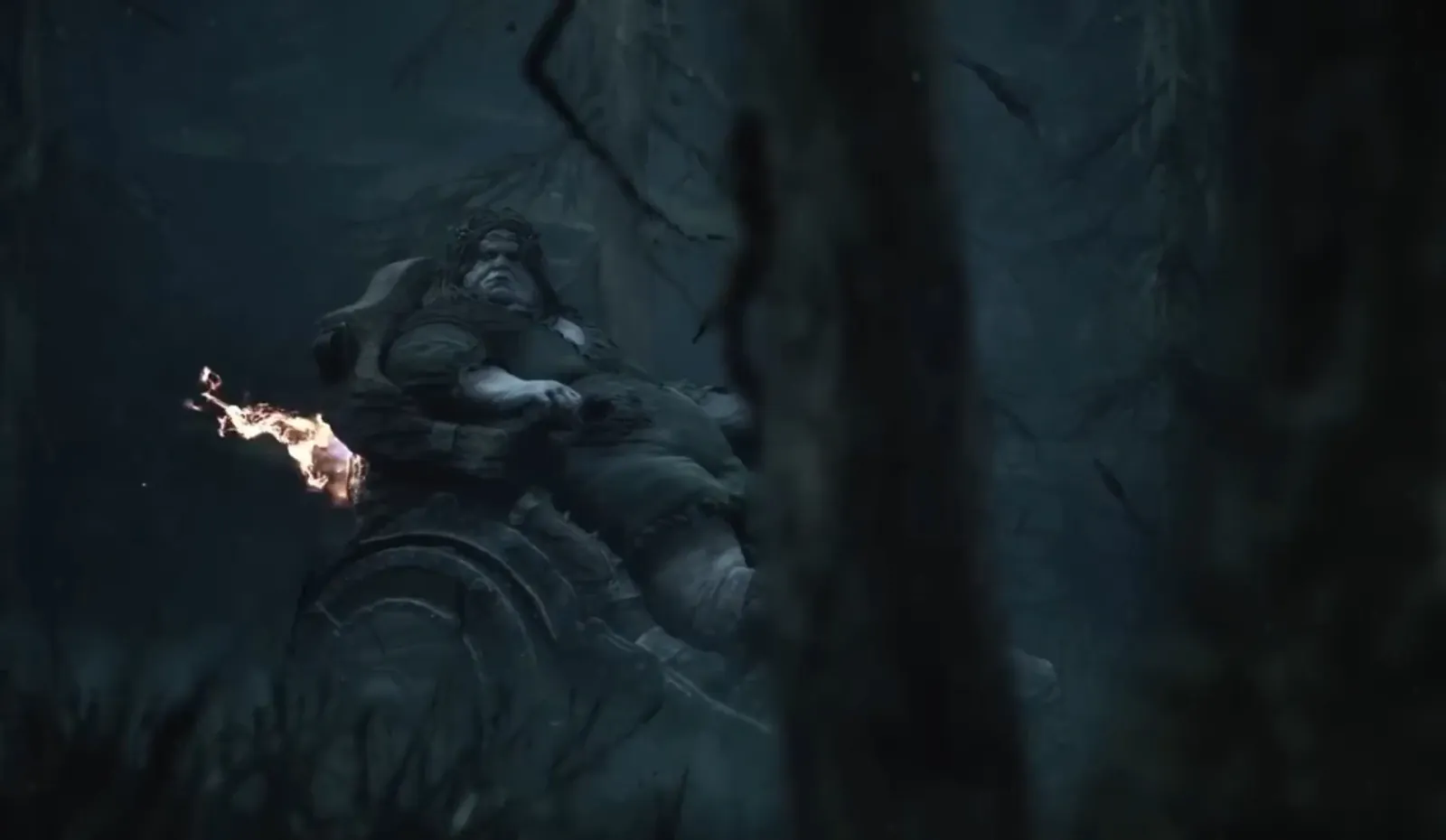 An armored figure stands among dark tree branches in the official Mortal Shell II gameplay-reveal poster.